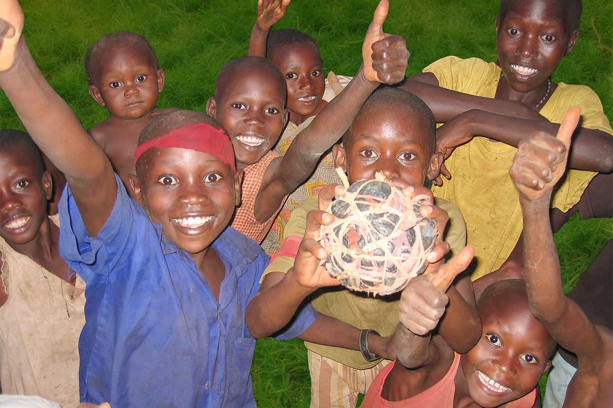 Kids holding their soccer ball made from banana fiber